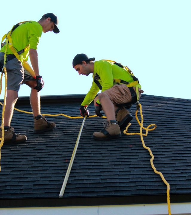 a couple of people that are on a roof